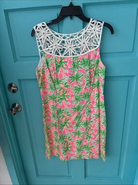 Lillie Pulitizer skeevless with open flower print neckline trim.